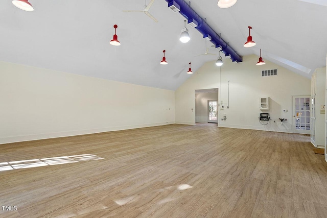 unfurnished living room with ceiling fan, high vaulted ceiling, and light wood-type flooring