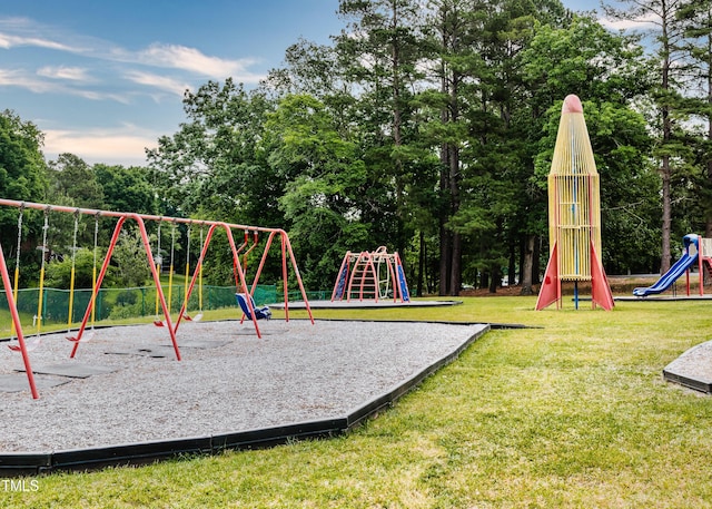 view of jungle gym with a lawn