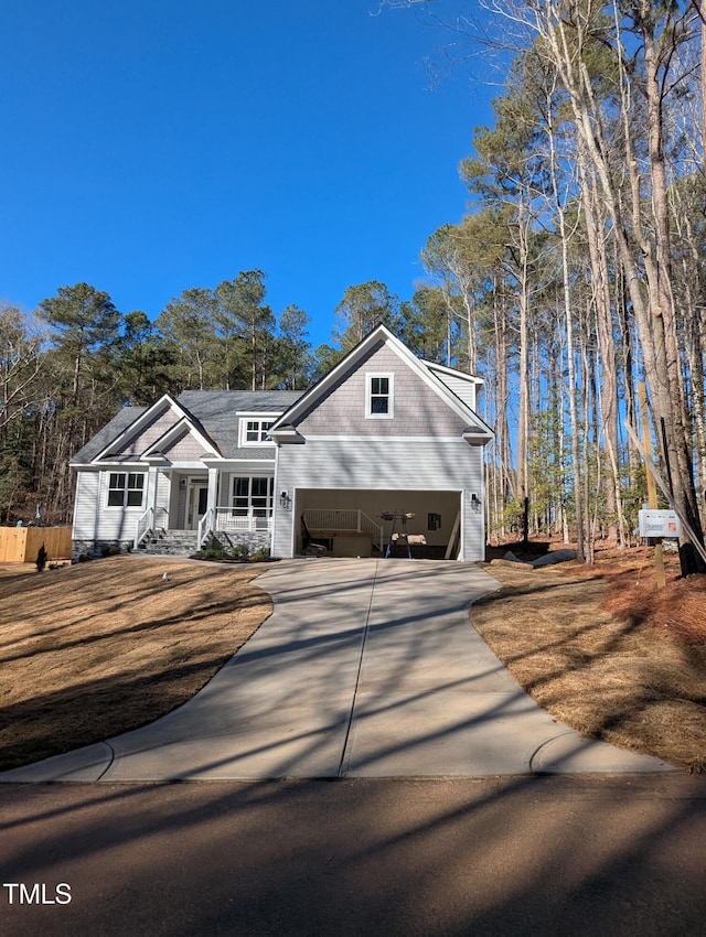 view of front facade with a garage and covered porch