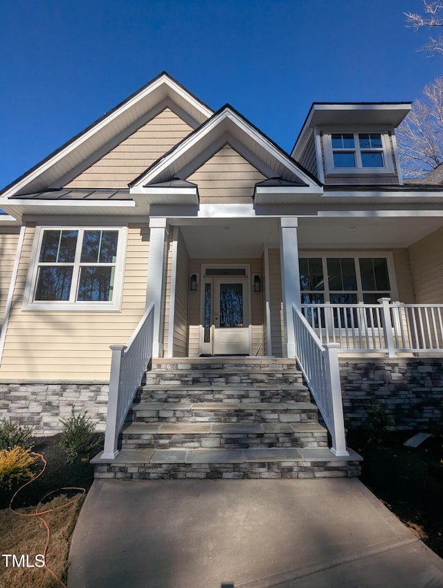 property entrance with covered porch