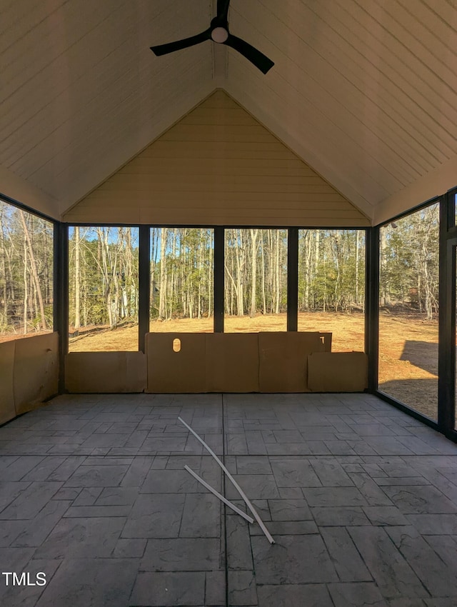 unfurnished sunroom featuring lofted ceiling and ceiling fan