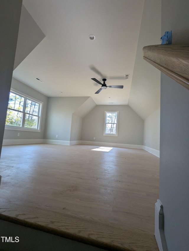 additional living space with ceiling fan, light hardwood / wood-style flooring, and lofted ceiling