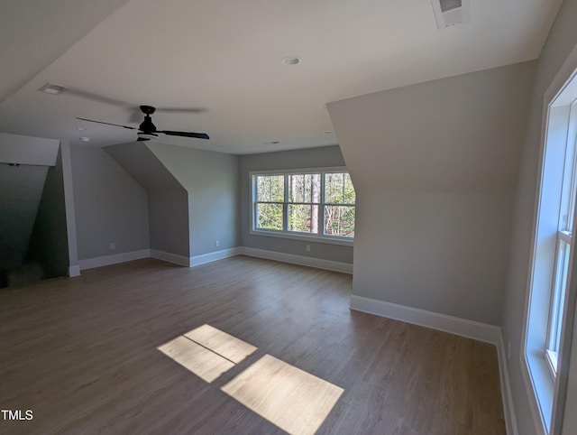 additional living space featuring lofted ceiling, ceiling fan, and wood-type flooring