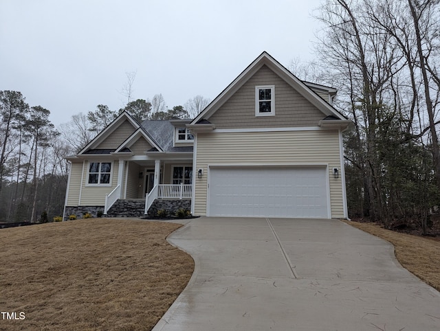 view of front of home featuring a garage and a porch