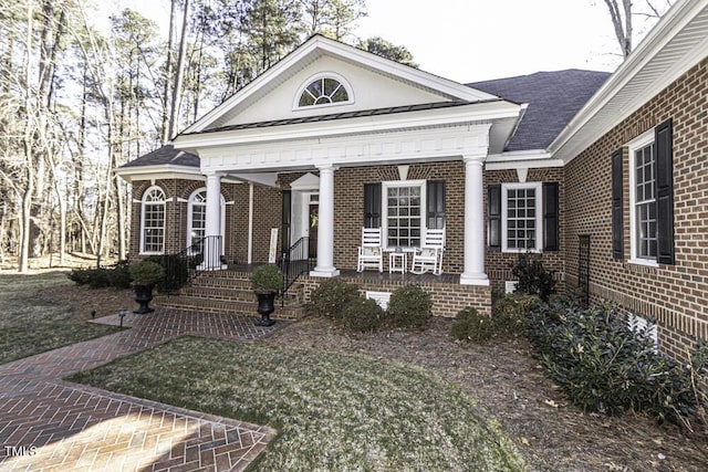 greek revival house with a front yard