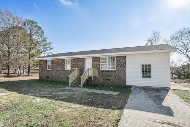 ranch-style home with a front lawn