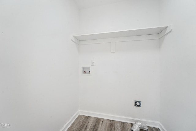 clothes washing area with hookup for an electric dryer, wood-type flooring, and washer hookup