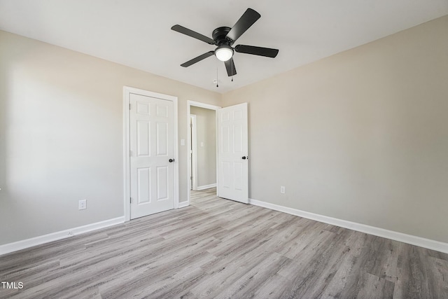 unfurnished bedroom featuring light hardwood / wood-style flooring and ceiling fan