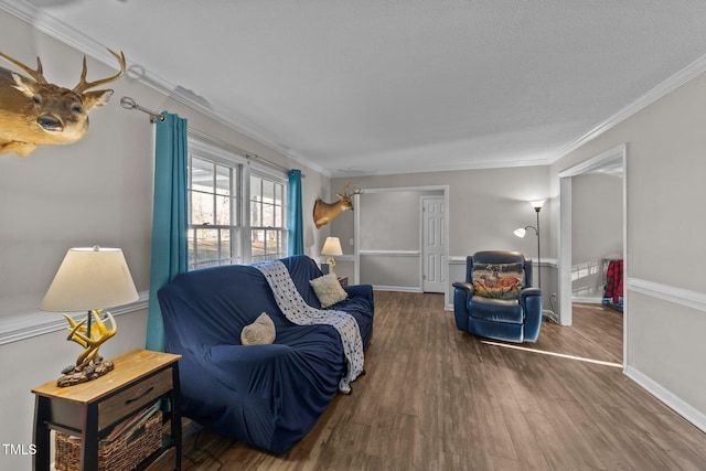 living room featuring ornamental molding and dark hardwood / wood-style floors