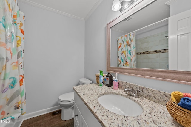 bathroom featuring vanity, wood-type flooring, ornamental molding, toilet, and walk in shower