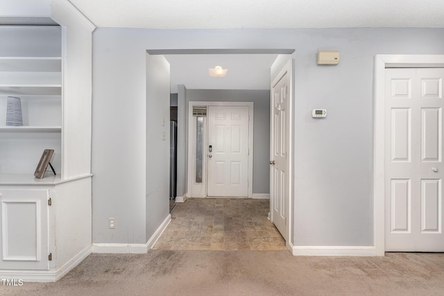 corridor with light colored carpet