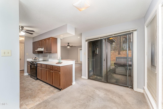 kitchen with range with electric stovetop, light colored carpet, a textured ceiling, and ceiling fan