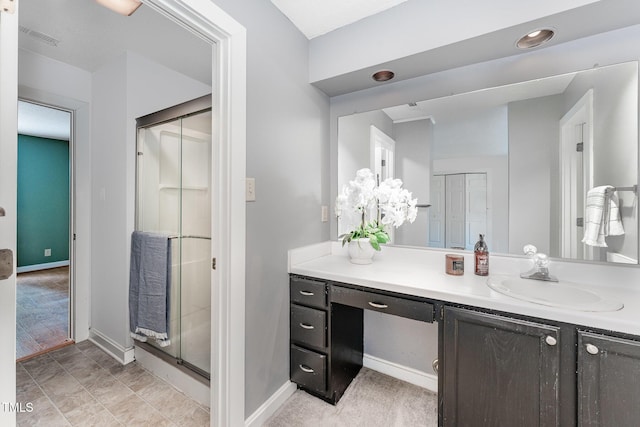 bathroom with vanity and walk in shower