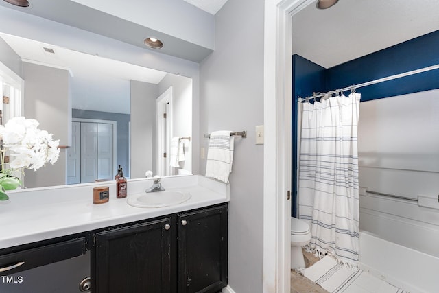 full bathroom with vanity, toilet, and shower / bath combo with shower curtain