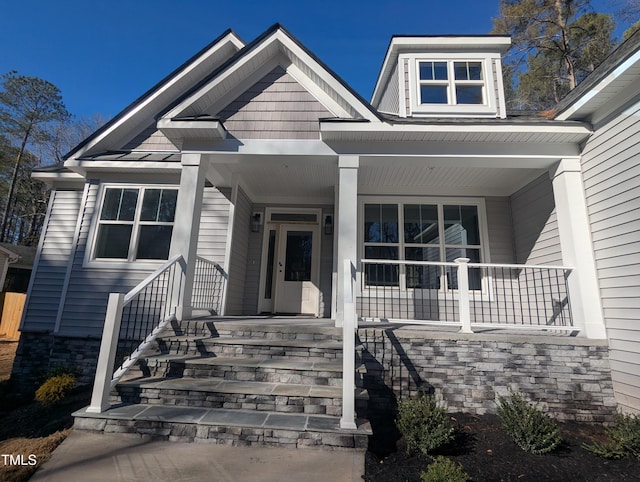 view of front of property featuring covered porch