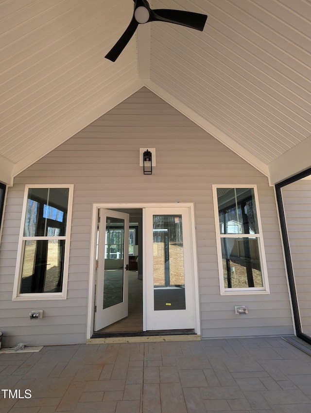 property entrance with ceiling fan and a patio area