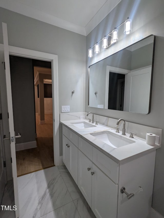 bathroom featuring vanity and ornamental molding