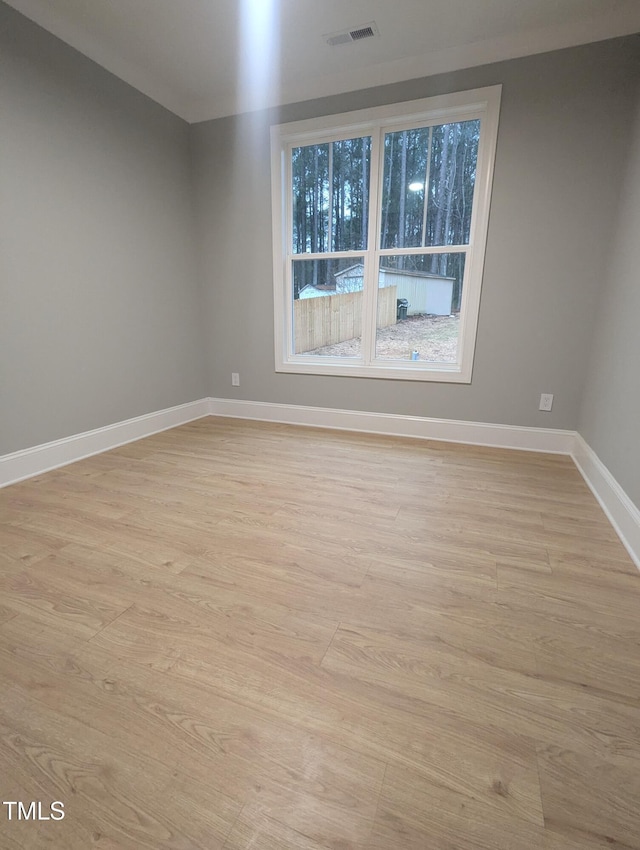 unfurnished room featuring light wood-type flooring