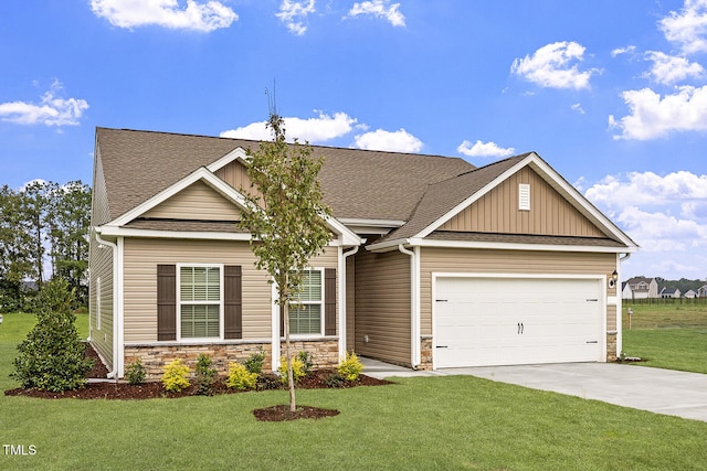 craftsman-style home featuring a garage and a front yard