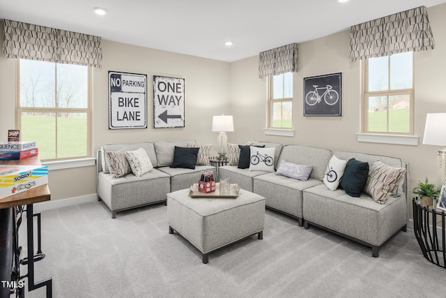 carpeted living room with a wealth of natural light