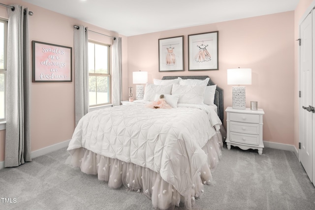 bedroom with light colored carpet