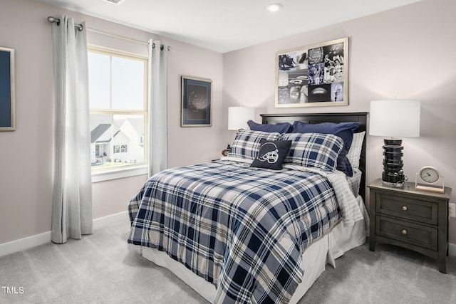 bedroom with light colored carpet