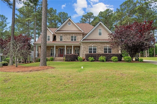 craftsman-style house with covered porch and a front yard