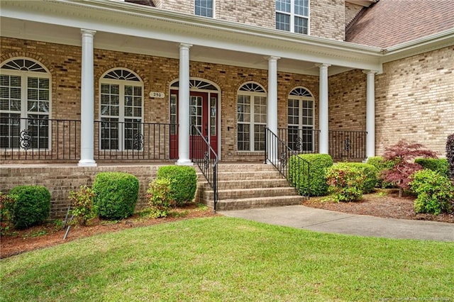 view of exterior entry with covered porch