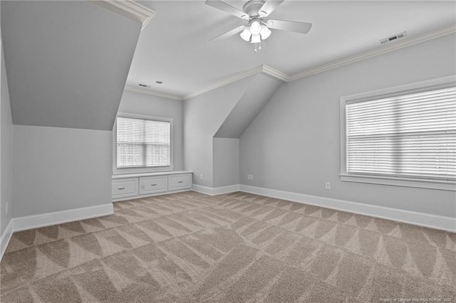 additional living space featuring ceiling fan, light carpet, and vaulted ceiling