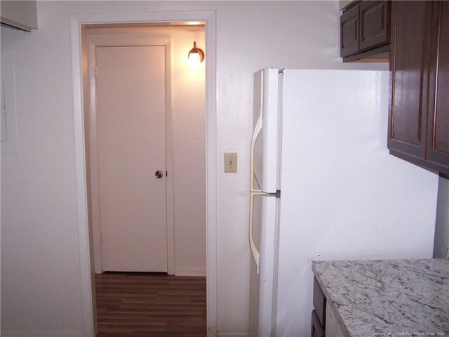 583 Winding Creek Rd Unit H, Fayetteville, NC 28305 - kitchen with white fridge, dark hardwood / wood-style flooring, dark brown cabinetry, and light stone counters