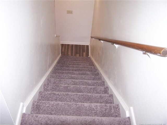 583 Winding Creek Rd Unit H, Fayetteville, NC 28305 - stairs featuring hardwood / wood-style flooring