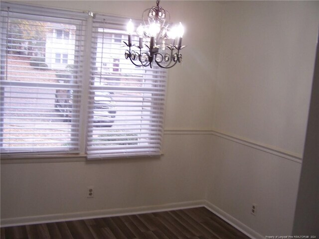 583 Winding Creek Rd Unit H, Fayetteville, NC 28305 - unfurnished dining area with plenty of natural light, dark hardwood / wood-style floors, and a notable chandelier