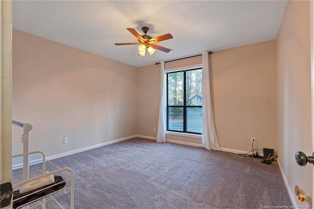 carpeted empty room with ceiling fan