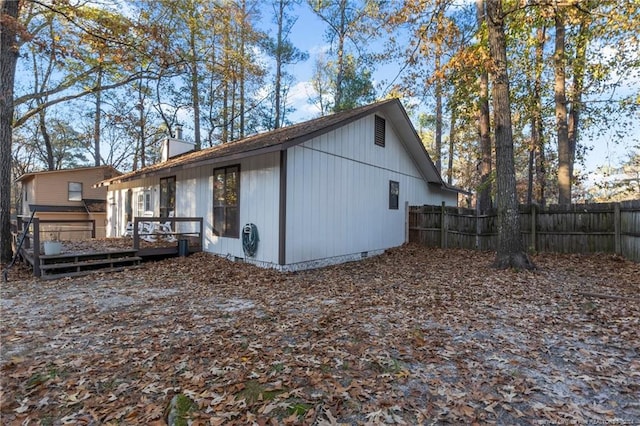 back of property featuring a deck