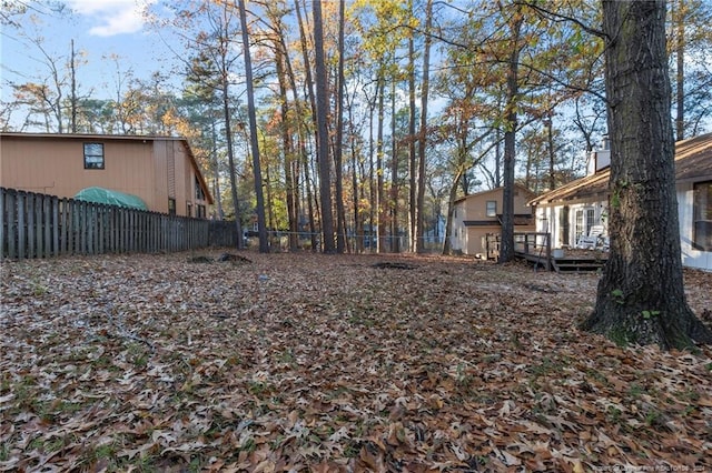 view of yard featuring a wooden deck