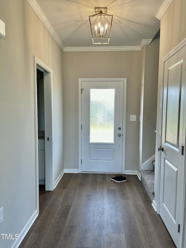 doorway to outside featuring dark hardwood / wood-style flooring, an inviting chandelier, and ornamental molding