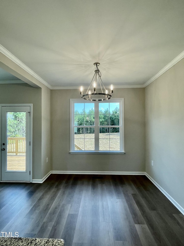 unfurnished dining area with dark hardwood / wood-style flooring, crown molding, plenty of natural light, and a notable chandelier