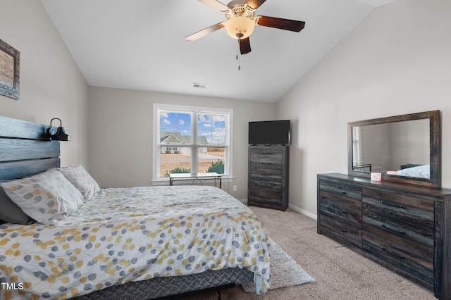 bedroom featuring ceiling fan, high vaulted ceiling, and light carpet