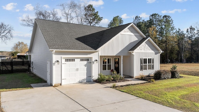 view of front facade with a garage and a front yard