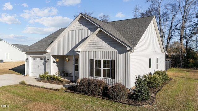 view of front of house with a front yard and a garage