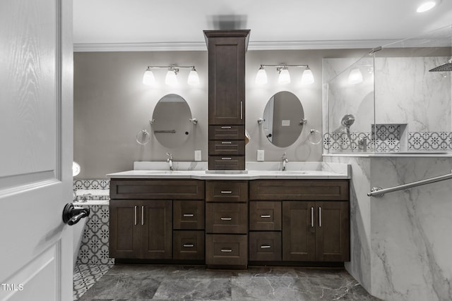 bathroom featuring ornamental molding and vanity