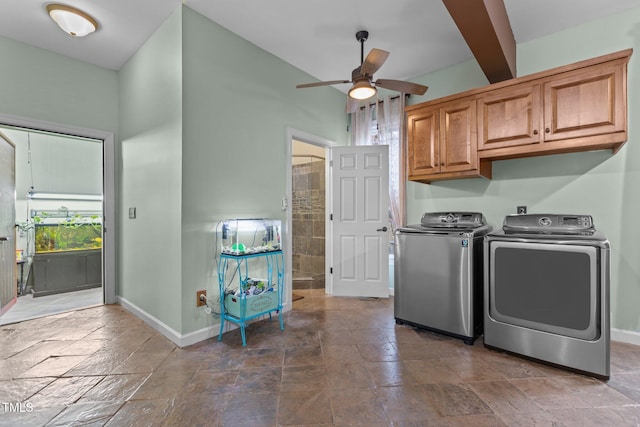 washroom featuring washer and clothes dryer, ceiling fan, and cabinets