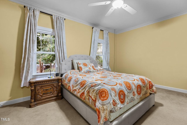 bedroom featuring ceiling fan, multiple windows, ornamental molding, and light carpet