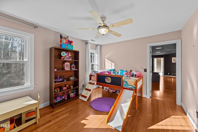 playroom featuring ceiling fan and hardwood / wood-style flooring