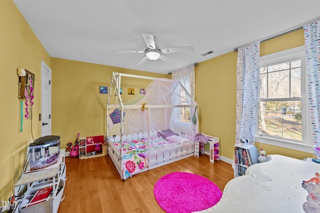 bedroom featuring ceiling fan and wood-type flooring