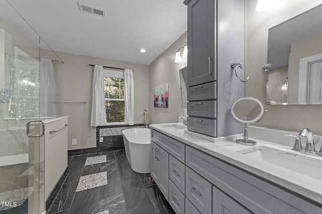 bathroom featuring separate shower and tub and vanity