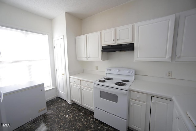 kitchen with white range with electric cooktop, white cabinetry, refrigerator, and a textured ceiling