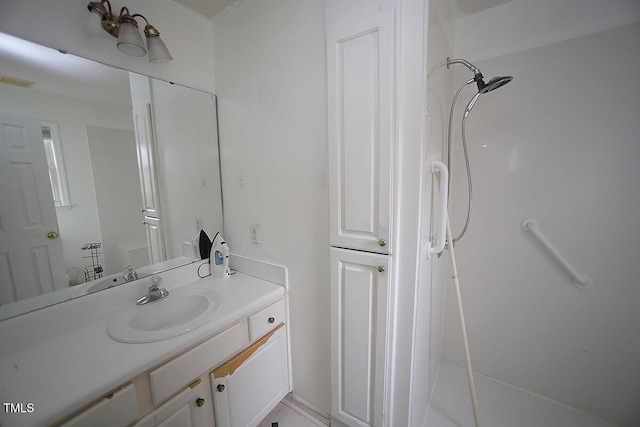 bathroom featuring vanity and walk in shower