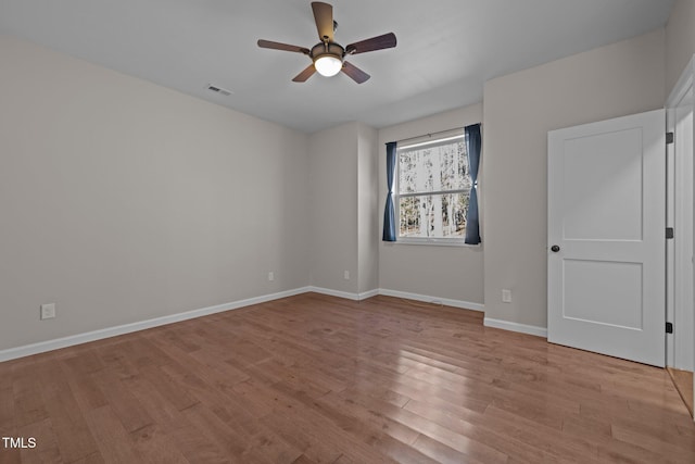 spare room featuring ceiling fan and light hardwood / wood-style flooring