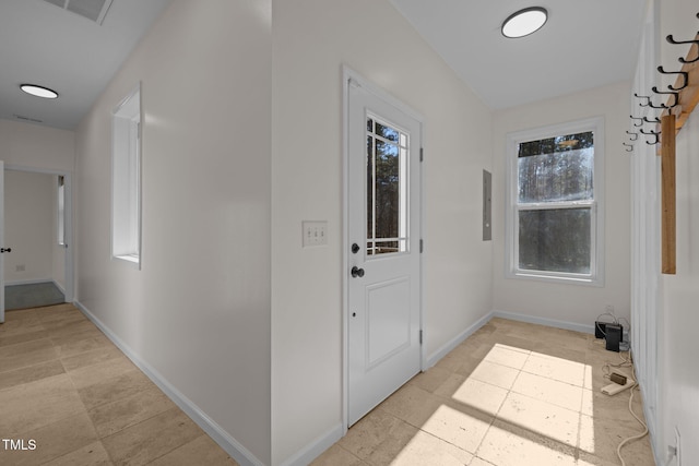 doorway to outside featuring electric panel